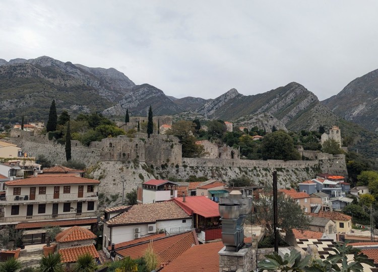 Picture of Stari Bar with the old city in the middle and the surrounding mountains 